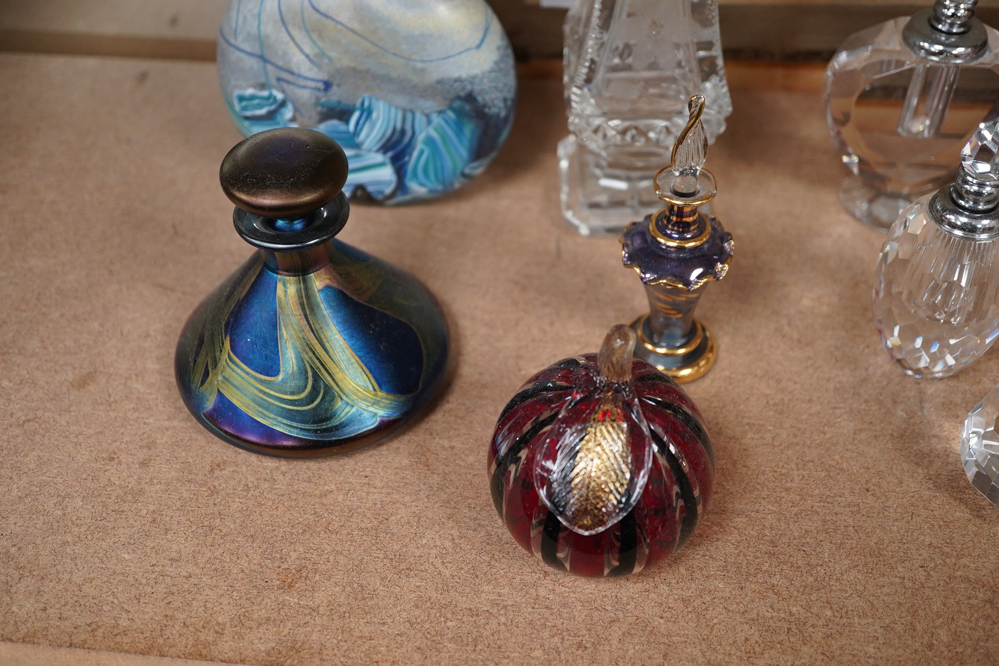 A collection of various glass scent bottles including a Lalique flower scent bottle and Bohemian examples, tallest 20.5cm. Condition - fair, some stoppers stuck